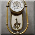 D06. Brass wall clock with mirror. 